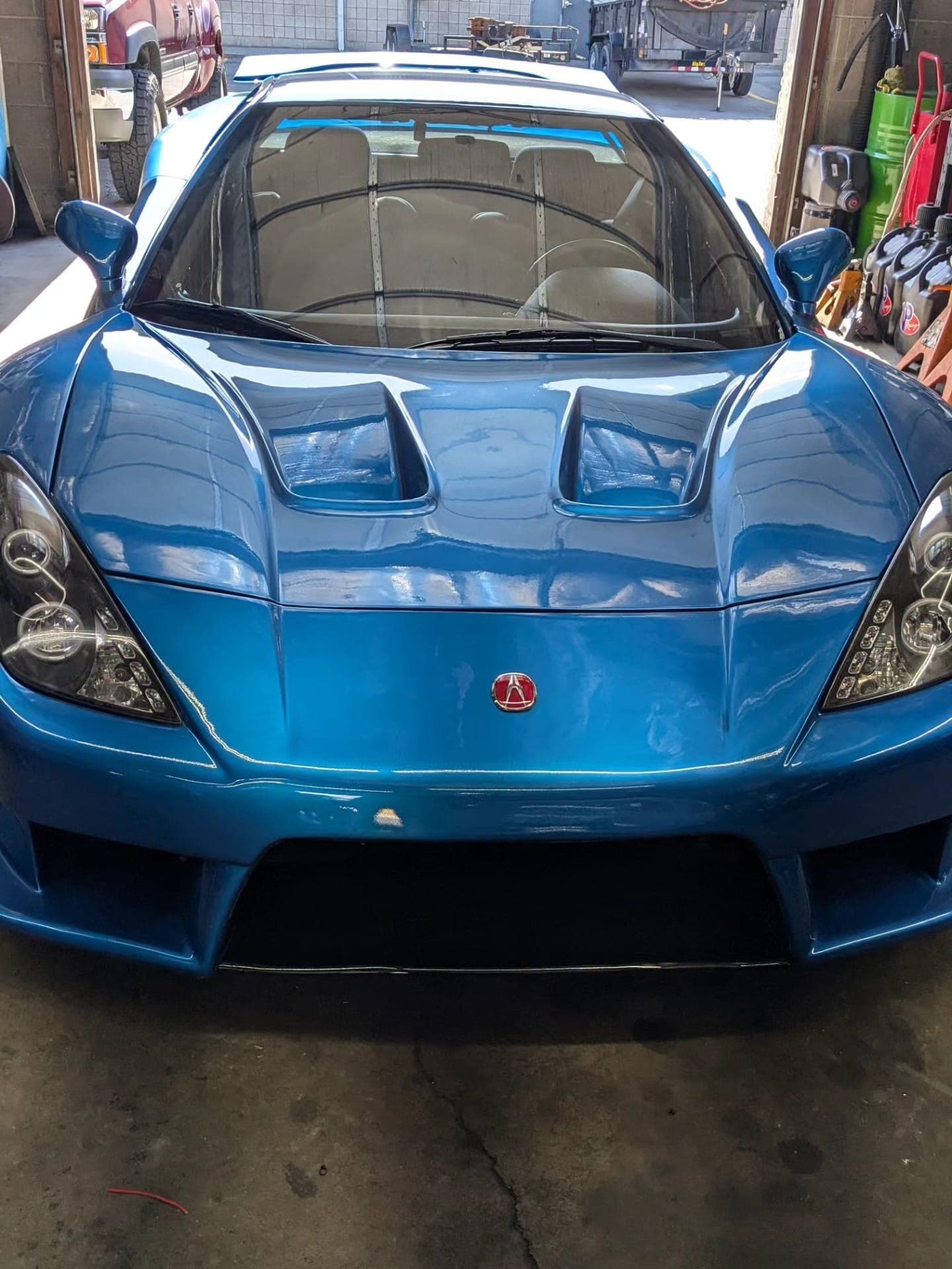 Blue Acura NSX with a VeilSide body kit in the shop at Turbo Lab in Orem, UT