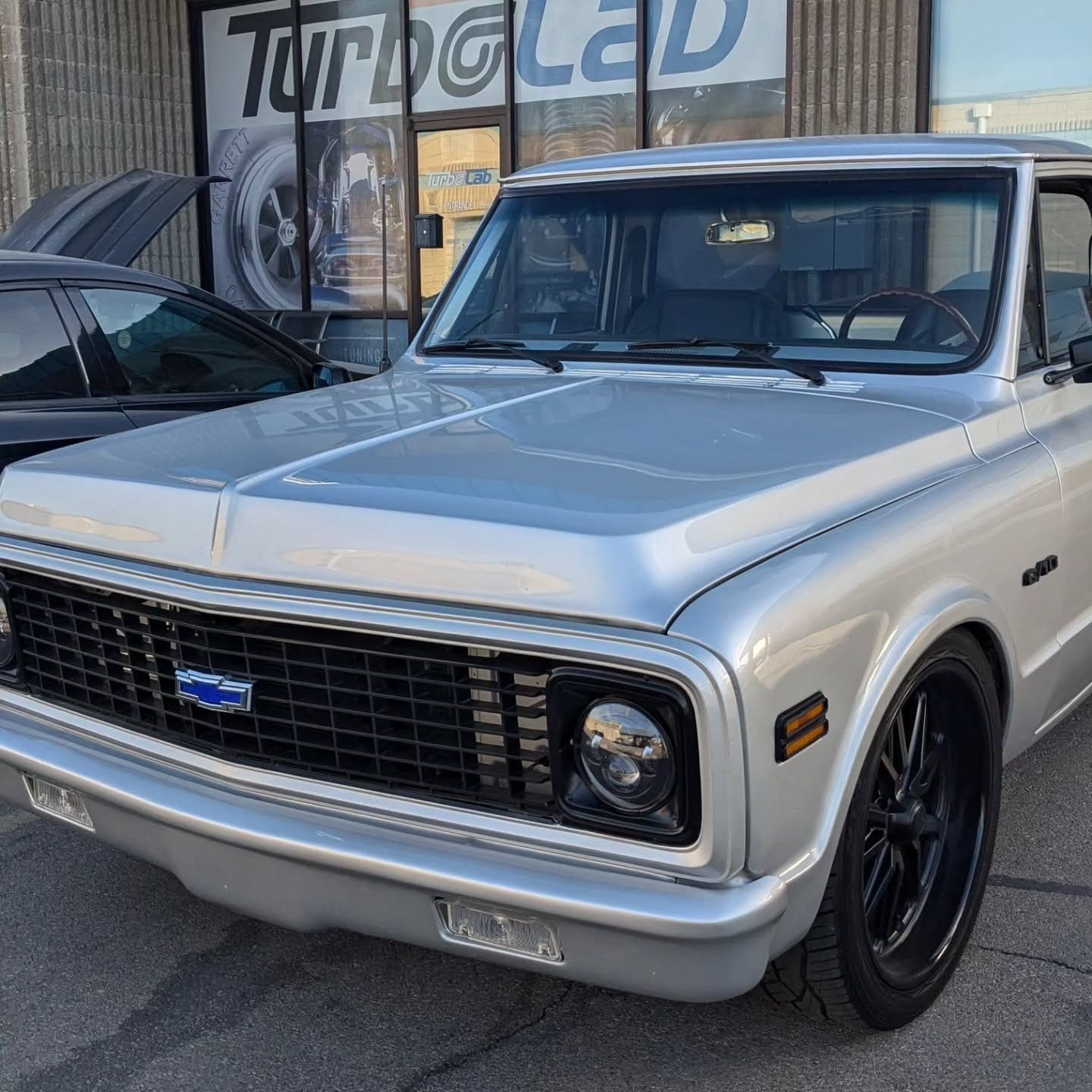 Silver LS-swapped Chevy C10 pickup parked in front of Turbo Lab in Orem, UT