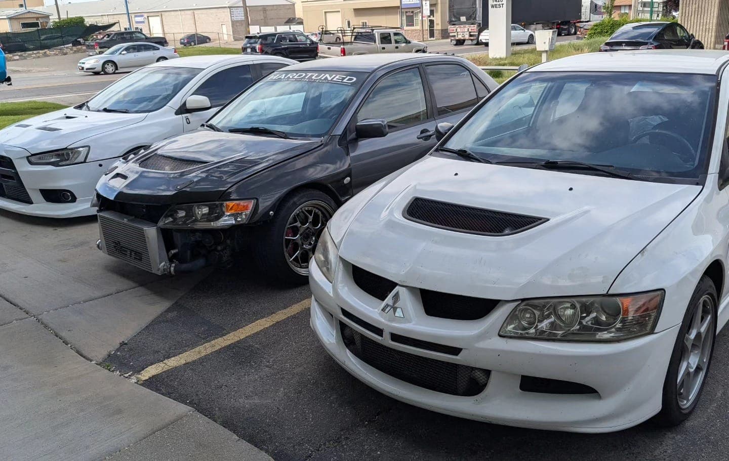 Mitsubishi Lancer Evolution 8, 9, and X lined up at Turbo Lab in Orem for tuning