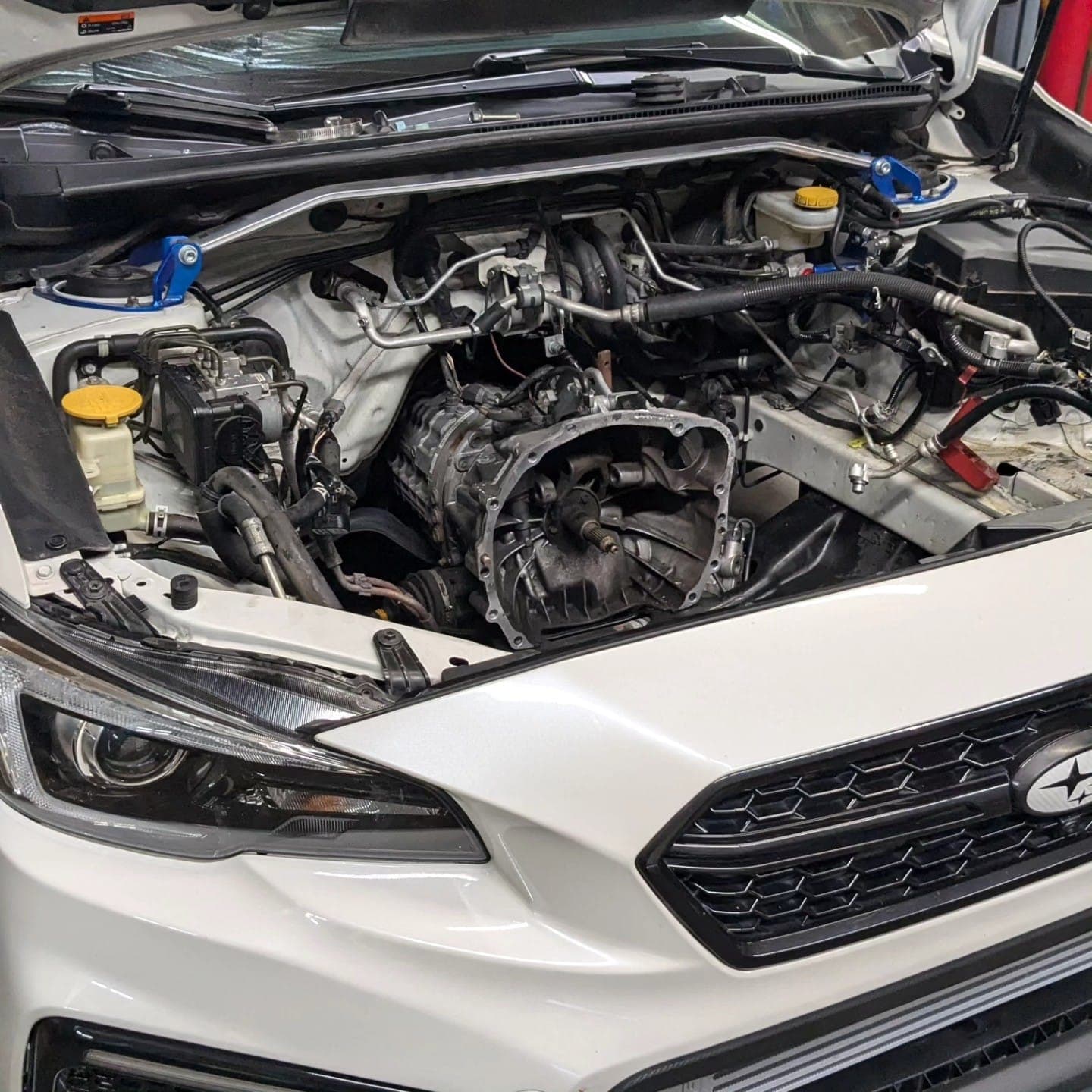 Subaru WRX engine bay with the engine out for a new short block at Turbo Lab in Orem