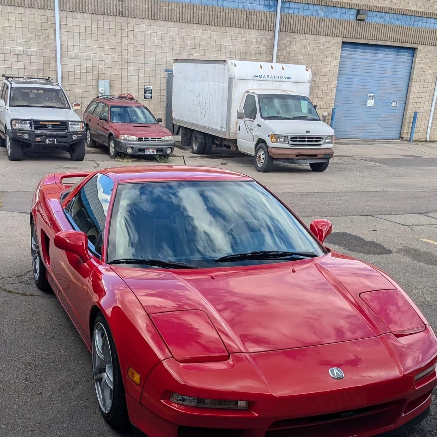 Red Acura NSX parked at Turbo Lab in Orem for a steering rack replacement