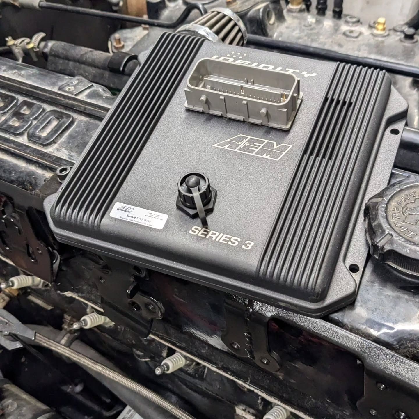 AEM Infinity standalone ECU installed in a Datsun 240Z project car at Turbo Lab