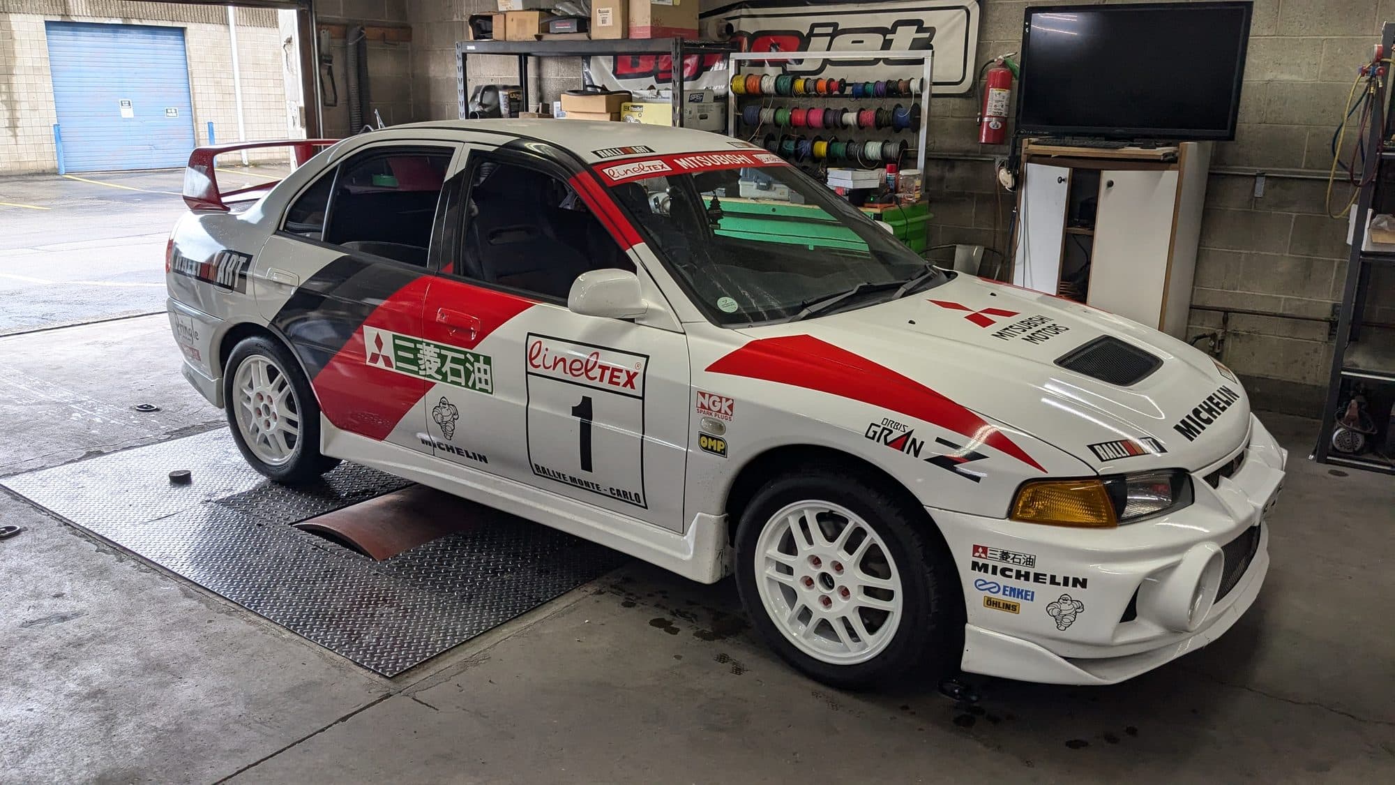 Mitsubishi Evo VI in rally livery on the dyno at Turbo Lab in Orem, UT