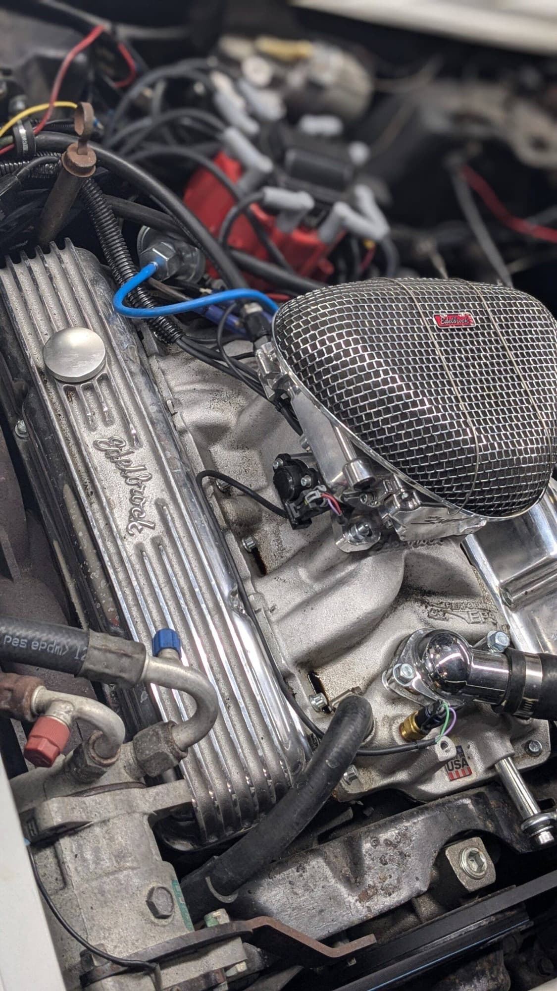 Small-block Chevy V8 with Edelbrock valve covers and intake in the shop at Turbo Lab in Orem
