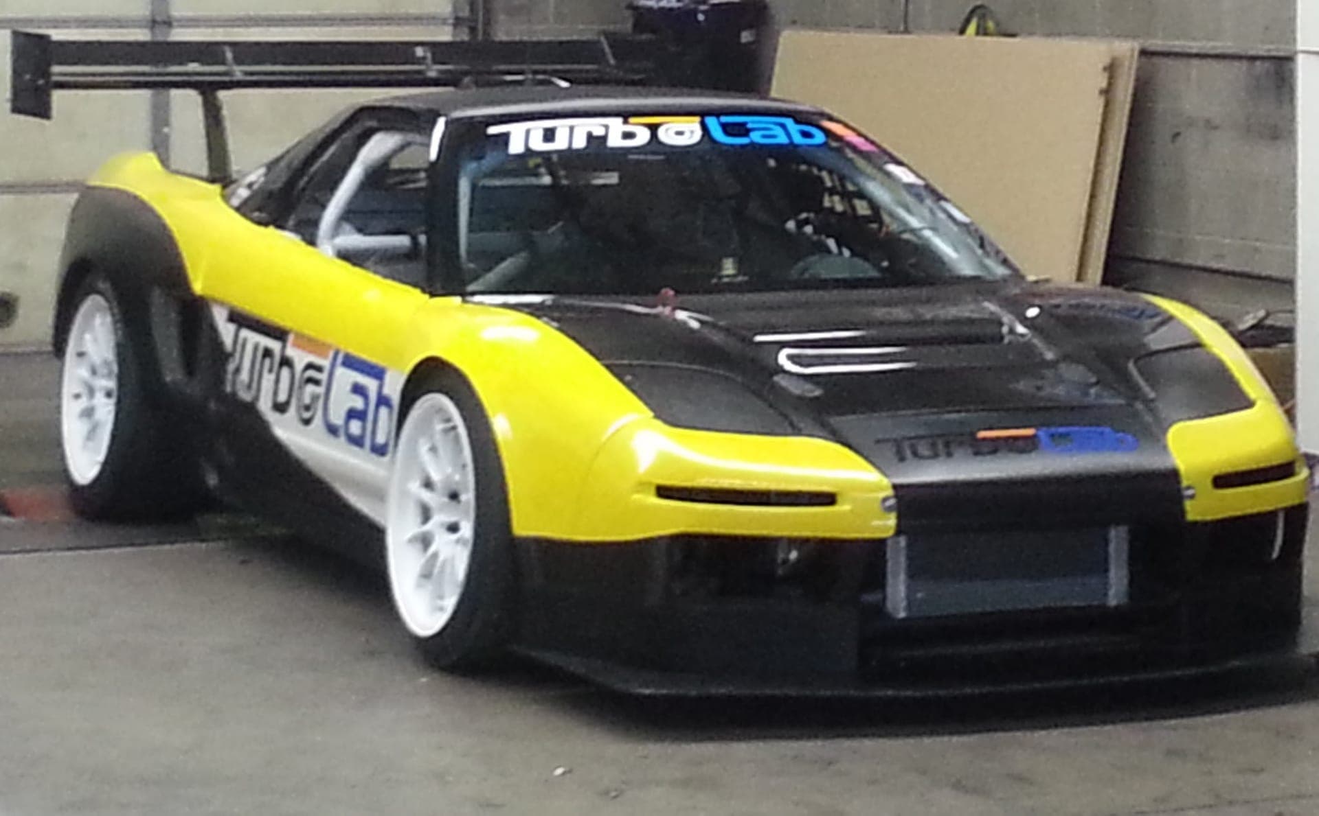 Turbo Lab liveried NSX race car with a roll cage and rear wing